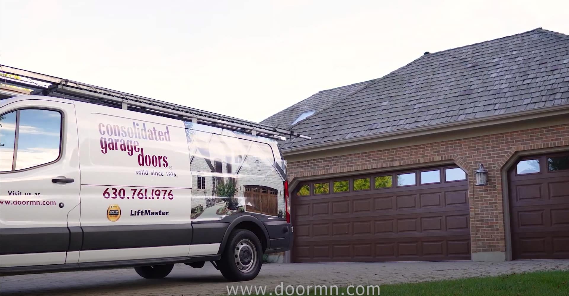 Consolidated Garage Doors Van Parked in Front of Garage Doors